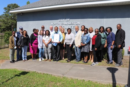 a group of people posing for a photo