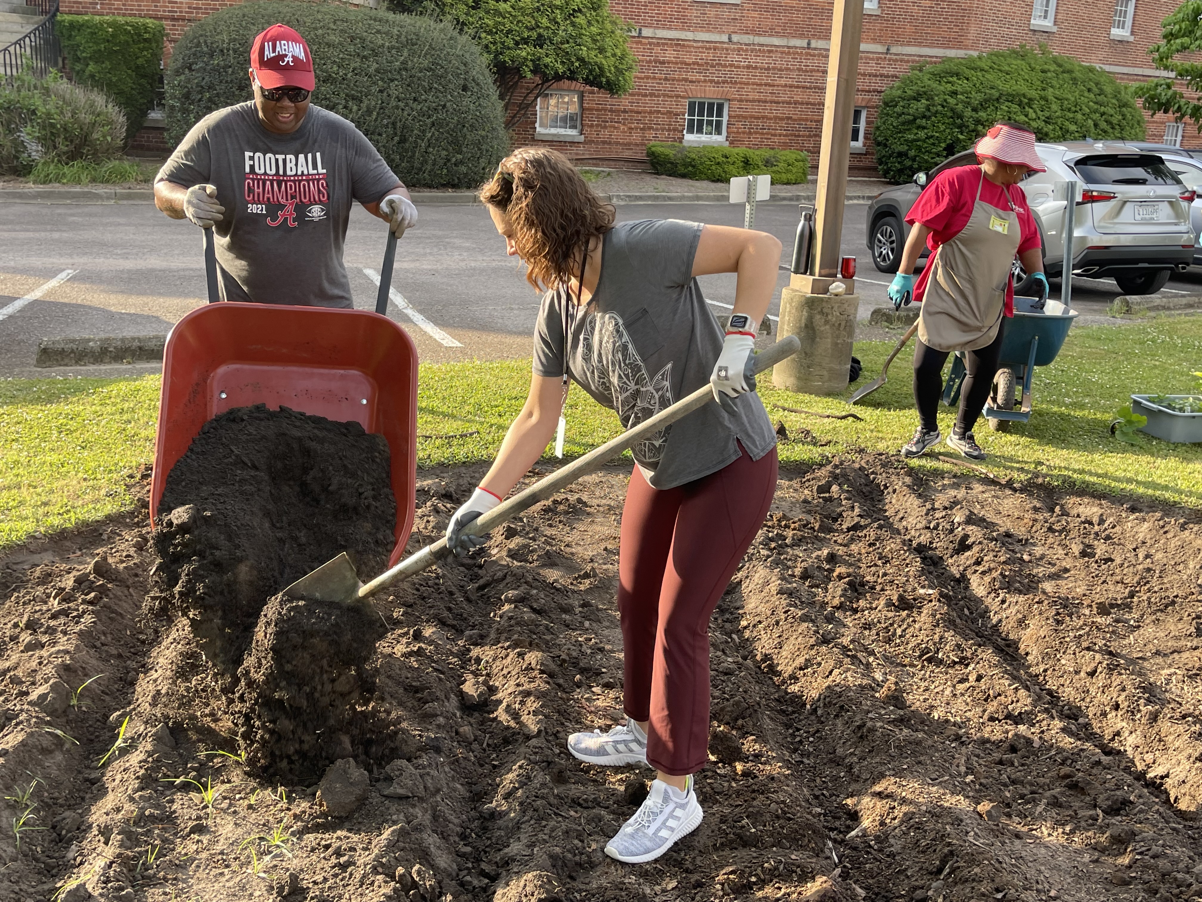 DHEC employees work on community demonstration garden