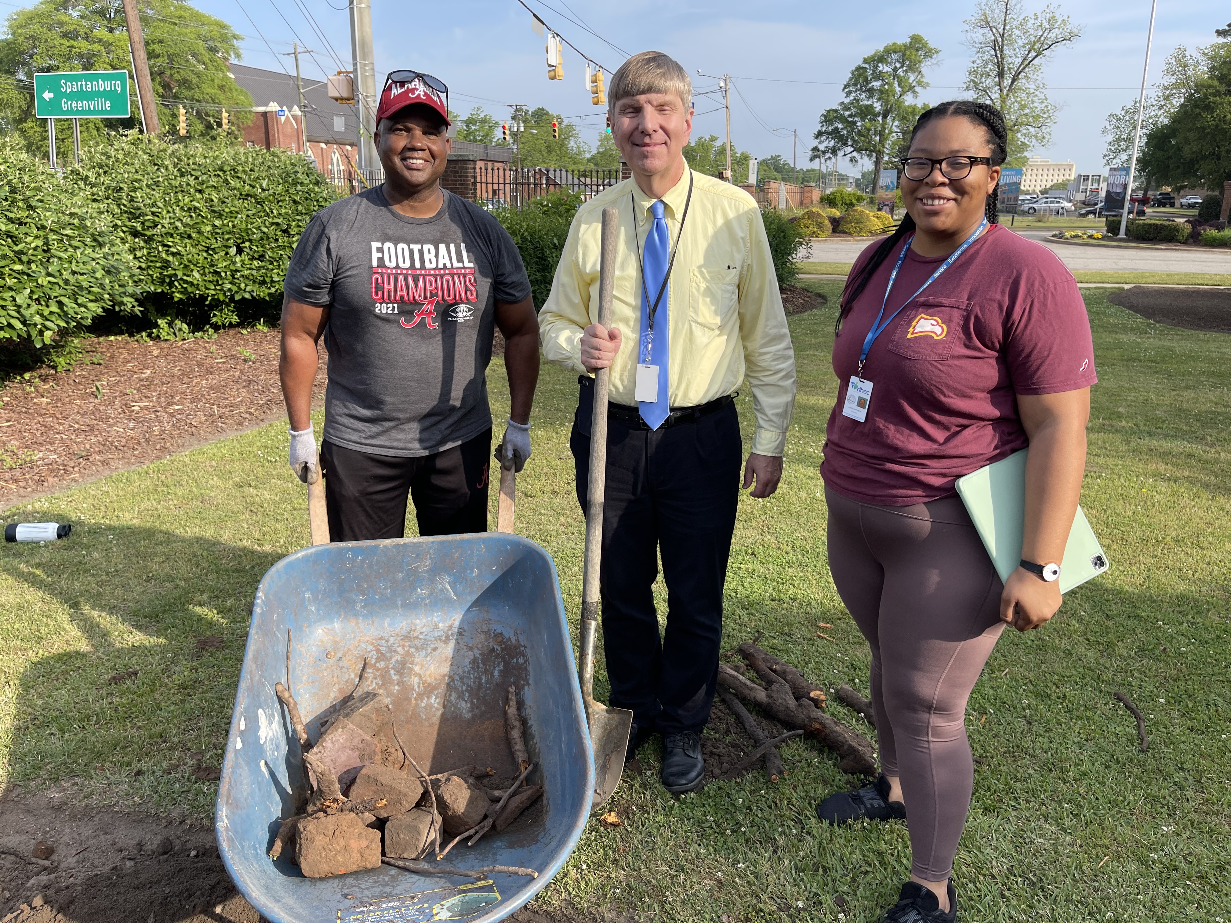 DHEC leaders pose while breaking ground on demonstration garden