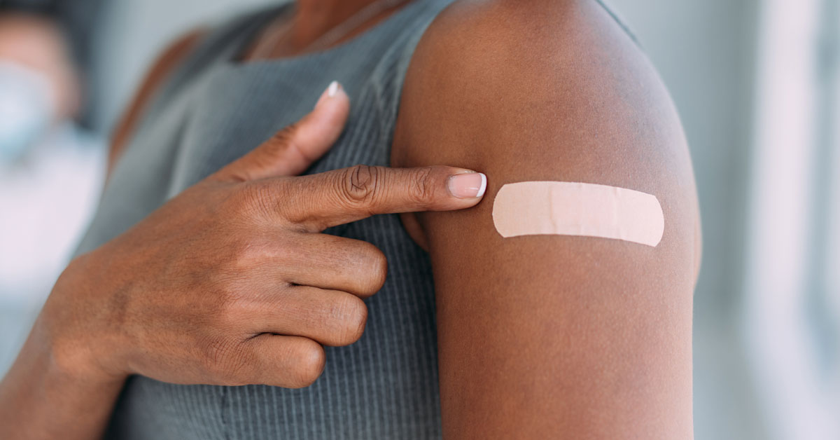 woman pointing to bandaid