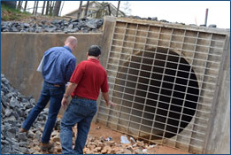 Dam Safety program staff inspecting dam